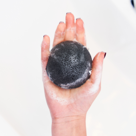 Konjac Sponge Infused With Charcoal in hand