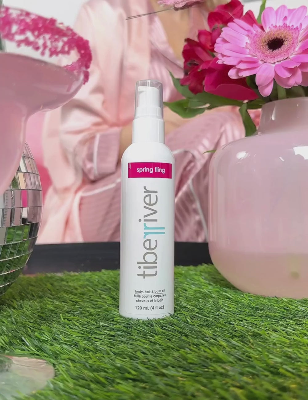 Spring Fling Body, Hair and Bath Oil being used on skin in video